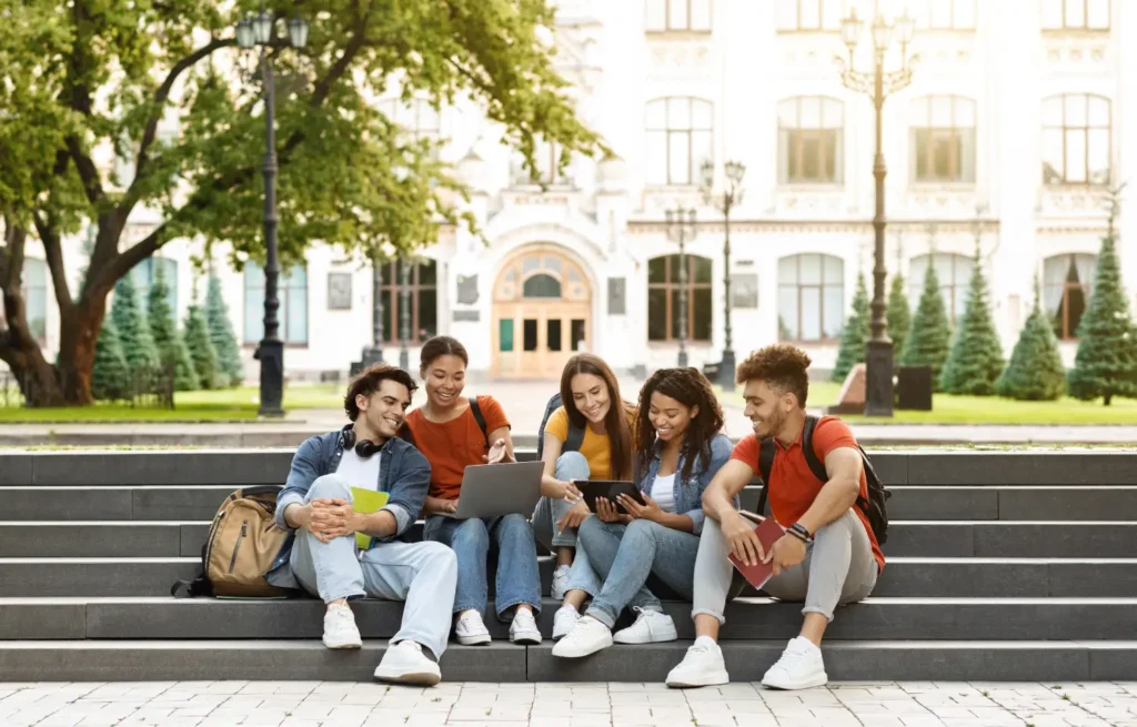 A group of college students sitting on the stairs